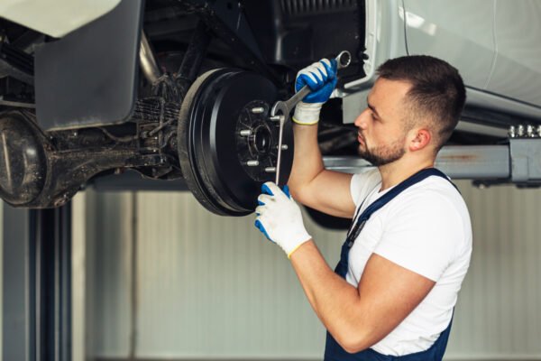 A Mechanic working on Car Brake Systems