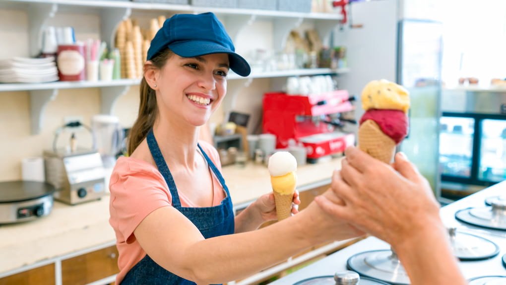 A girl serving Frozen Food made by Commercial Ice Cream Machine Uk